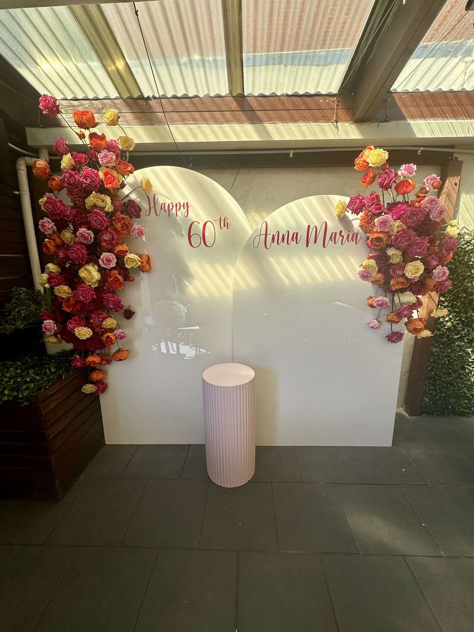 60th Birthday Backdrop, Silk Florals, White Acrylic Arch, Ripple Plinth