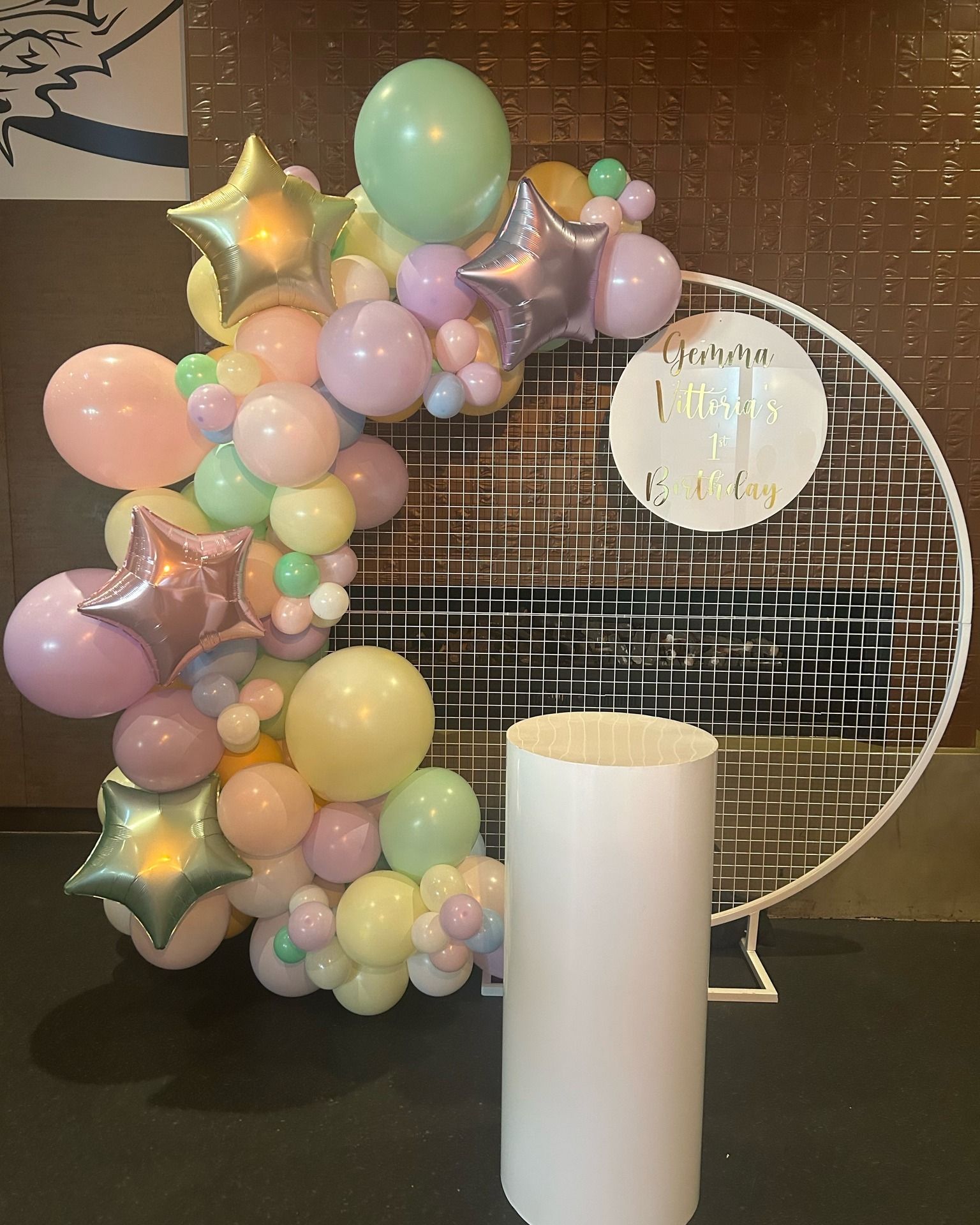 Balloon Garland attached to White Mesh